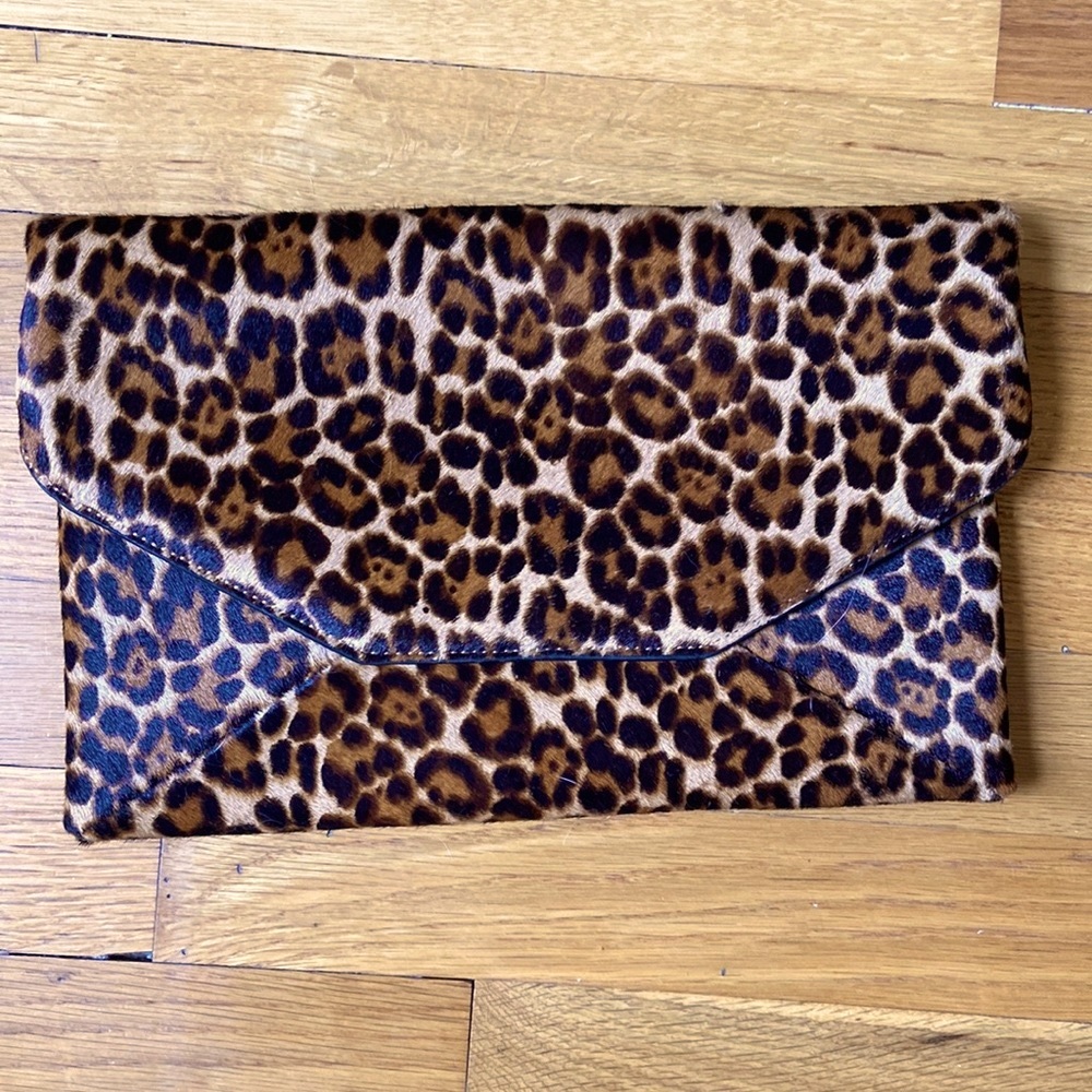 Ann Taylor leopard clutch, never used.